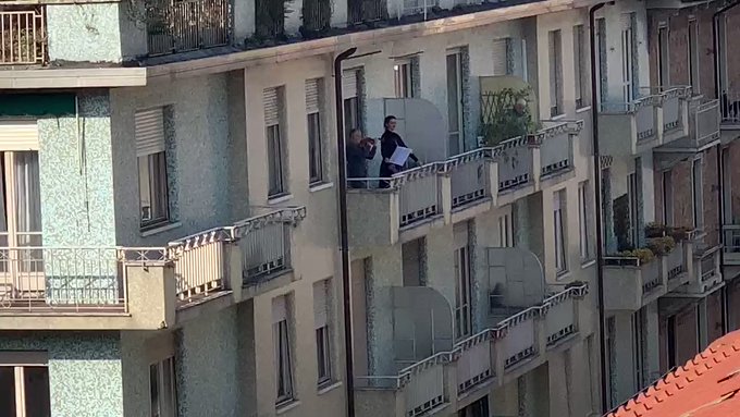 Italians sing from window